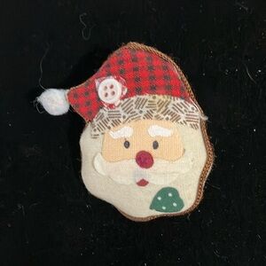 Puffy Santa pin.  2.5”. Clasp pin.  Button accent.